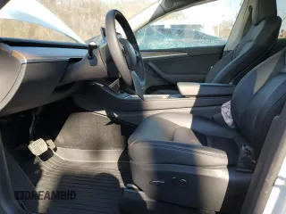 2023 Tesla Model Y Long Range z VIN 7SAYGDEE5PF785124, wystawiony jako Copart lot #56553785 z przebiegiem 31 341 mil mil oraz Szkoda całkowita • Salvage title. Historia ofert i sprzedaży dostępna na DreamBid. Obrazek 7.