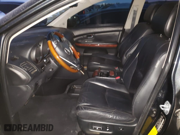 2007 Lexus RX 400h z VIN JTJGW31U172005381, wystawiony jako Copart lot #85118324 z przebiegiem 145 757 mil mil oraz Szkody całkowita. Historia ofert i sprzedaży dostępna na DreamBid. Obrazek 7.