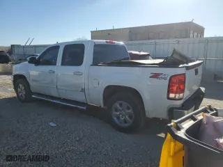 2013 GMC Sierra 1500 SLT with VIN 3GTP2WE74DG337547, listed as a Copart auction lot 82698644 with 185,146 mi miles and Salvage Title. Bid and sale history available at carsss.com. Image 2.