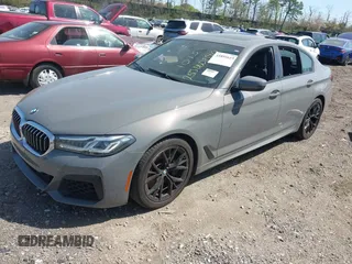 2021 BMW 5 Series 540i xDrive with VIN WBA73BJ03MWX30307, listed as a IAAI auction lot 41891615 with 27,374 mi miles and . Bid and sale history available at DreamBid. Image 2.