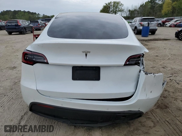 2021 Tesla Model Y Standard Range z VIN 5YJYGDED1MF109091, wystawiony jako Copart lot #50414004 z przebiegiem Nie podano mil oraz Szkody całkowita. Historia ofert i sprzedaży dostępna na DreamBid. Obrazek 6.