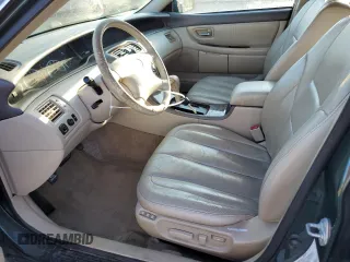 2001 Toyota Avalon XL z VIN 4T1BF28B81U162506, wystawiony jako Copart lot #52031805 z przebiegiem 212 437 mil mil oraz Szkody całkowita. Historia ofert i sprzedaży dostępna na DreamBid. Obrazek 7.