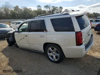 2015 Chevrolet Tahoe LTZ with VIN 1GNSCCKCXFR102314, listed as a Copart auction lot 48479825 with 218,901 mi miles and Salvage Title. Bid and sale history available at carsss.com. Image 2.