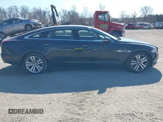 2013 Jaguar XJ Portfolio with VIN SAJWJ2GDXD8V55879, listed as a IAAI auction lot 41568366 with 121,119 mi miles and . Bid and sale history available at DreamBid. Image 13.