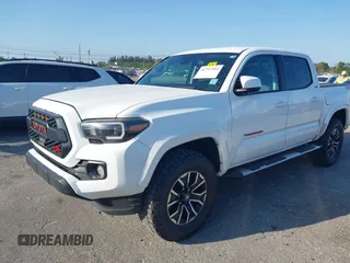 2018 Toyota Tacoma SR with VIN 5TFAX5GN2JX128621, listed as a IAAI auction lot 41797514 with 216,251 mi miles and . Bid and sale history available at DreamBid. Image 2.