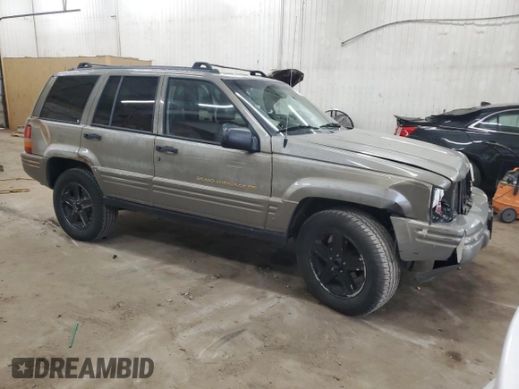 1996 Jeep Grand Cherokee Limited z VIN 1J4GZ78S5TC210710, wystawiony jako Copart lot #81307904 z przebiegiem 285 169 mil mil oraz Szkoda całkowita • Salvage title. Historia ofert i sprzedaży dostępna na DreamBid. Obrazek 4.