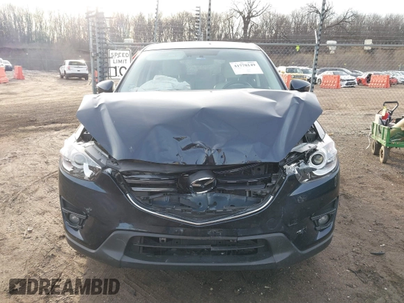 2016 Mazda CX-5 Grand Touring with VIN JM3KE4DY1G0823989, listed as a IAAI auction lot 41770149 with 40,677 mi miles. Bid and sale history available at carsss.com. Image 12.