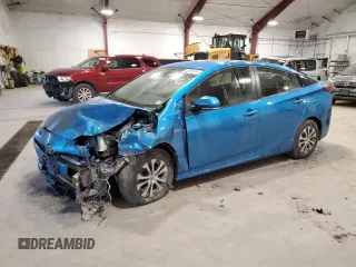 2021 Toyota Prius LE z VIN JTDL9MFU2M3029444, wystawiony jako Copart lot #52958865 z przebiegiem Nie podano mil oraz Szkoda całkowita • Salvage title. Historia ofert i sprzedaży dostępna na DreamBid. Obrazek 1.