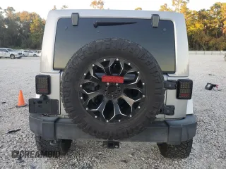 2017 Jeep Wrangler Unlimited Sahara with VIN 1C4HJWEG8HL697341, listed as a Copart auction lot 81313424 with 118,693 mi miles and Salvage title. Bid and sale history available at DreamBid. Image 6.