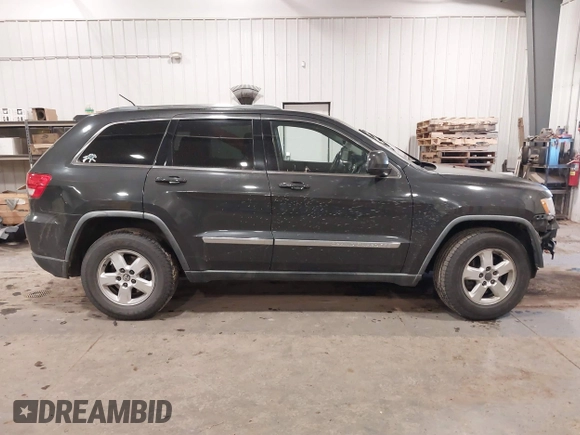 2011 Jeep Grand Cherokee 70th Anniversary with VIN 1J4RR4GG3BC745652, listed as a IAAI auction lot 41133698 with 217,948 mi miles. Bid and sale history available at carsss.com. Image 13.
