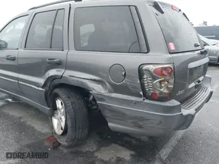 2004 Jeep Grand Cherokee Laredo with VIN 1J4GX48S14C177923, listed as a IAAI auction lot 41745772 with 242,506 mi miles. Bid and sale history available at carsss.com. Image 6.