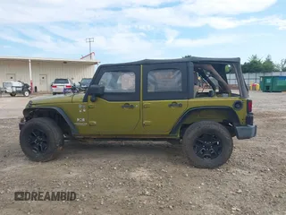 2007 Jeep Wrangler Unlimited X with VIN 1J4GA39177L164566, listed as a IAAI auction lot 42588655 with 50,915 mi miles and . Bid and sale history available at DreamBid. Image 14.