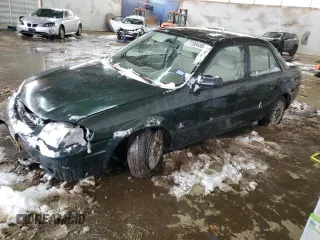 1999 Mazda Protege DX with VIN JM1BJ2220X0108600, listed as a Copart auction lot 77004894 with 220,836 mi miles and Salvage Title. Bid and sale history available at DreamBid. Image 1.