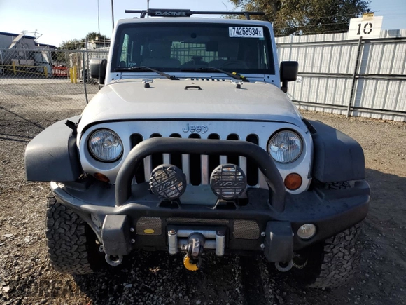 2009 Jeep Wrangler Rubicon with VIN 1J4GA64149L757121, listed as a Copart auction lot 74258934 with 73,241 mi miles and Salvage Title. Bid and sale history available at DreamBid. Image 5.