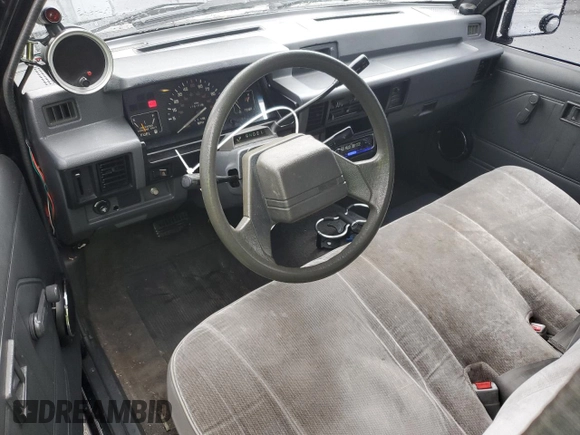 1991 Mitsubishi Mighty Max z VIN JA7FL25W7MP028365, wystawiony jako Copart lot #43964285 z przebiegiem 175 102 mil mil oraz Szkody całkowita. Historia ofert i sprzedaży dostępna na DreamBid. Obrazek 8.