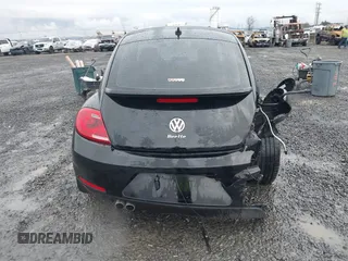 2014 Volkswagen Beetle 2.5L w/Sun with VIN 3VWJP7AT3EM608906, listed as a IAAI auction lot 41501830 with 42,804 mi miles and . Bid and sale history available at DreamBid. Image 16.