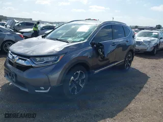 2019 Honda CR-V Touring with VIN 7FARW1H99KE005270, listed as a IAAI auction lot 41762812 with 122,583 mi miles. Bid and sale history available at carsss.com. Image 2.