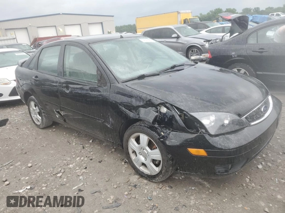 2005 Ford Focus S with VIN 1FAFP34N45W285454, listed as a Copart auction lot 59043485 with 165,071 mi miles and Salvage title. Bid and sale history available at DreamBid. Image 4.