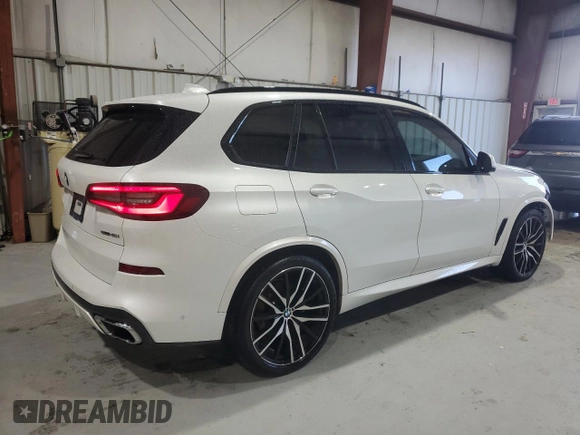 2021 BMW X5 sDrive40i with VIN 5UXCR4C09M9F61659, listed as a Copart auction lot 58670335 with Not provided miles and Salvage title. Bid and sale history available at DreamBid. Image 3.