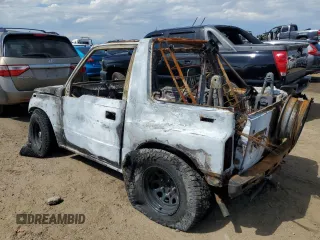 1992 Geo Tracker z VIN 2CNBJ18U5N6929792, wystawiony jako Copart lot #68870474 z przebiegiem Nie podano mil oraz Nie do naprawy. Historia ofert i sprzedaży dostępna na DreamBid. Obrazek 2.