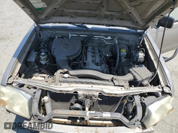 2004 Nissan Frontier XE with VIN 1N6DD26TX4C447116, listed as a Copart auction lot 59432335 with 127,001 mi miles and Salvage title. Bid and sale history available at DreamBid. Image 11.