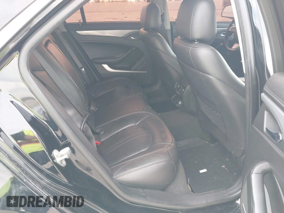 2013 Cadillac CTS Performance with VIN 1G6DJ5E37D0156897, listed as a IAAI auction lot 41359292 with 152,051 mi miles and . Bid and sale history available at DreamBid. Image 8.