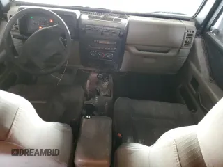 2003 Jeep Wrangler Sahara with VIN 1J4FA59S03P336844, listed as a Copart auction lot 49290345 with 167,726 mi miles and Salvage title. Bid and sale history available at DreamBid. Image 8.