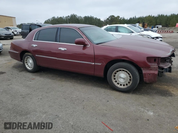 1999 Lincoln Town Car Executive z VIN 1LNHM81W5XY655075, wystawiony jako Copart lot #43263935 z przebiegiem Nie podano mil oraz Szkoda całkowita • Salvage title. Historia ofert i sprzedaży dostępna na DreamBid. Obrazek 4.