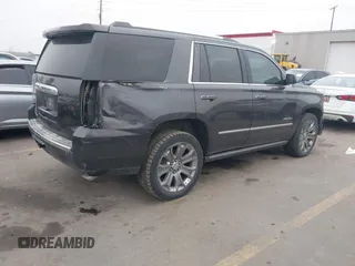 2015 GMC Yukon Denali with VIN 1GKS2CKJ2FR705806, listed as a IAAI auction lot 41568322 with 171,011 mi miles. Bid and sale history available at carsss.com. Image 4.