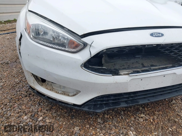 2018 Ford Focus SE z VIN 1FADP3F23JL225333, wystawiony jako IAAI lot #41758445 z przebiegiem 133 307 mil mil oraz . Historia ofert i sprzedaży dostępna na DreamBid. Obrazek 6.