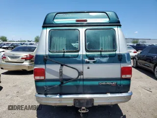 1994 Chevrolet Chevy Van z VIN 1GBEG25K9RF176079, wystawiony jako Copart lot #65824634 z przebiegiem 180 507 mil mil oraz Czysty tytuł • Clean title. Historia ofert i sprzedaży dostępna na DreamBid. Obrazek 6.