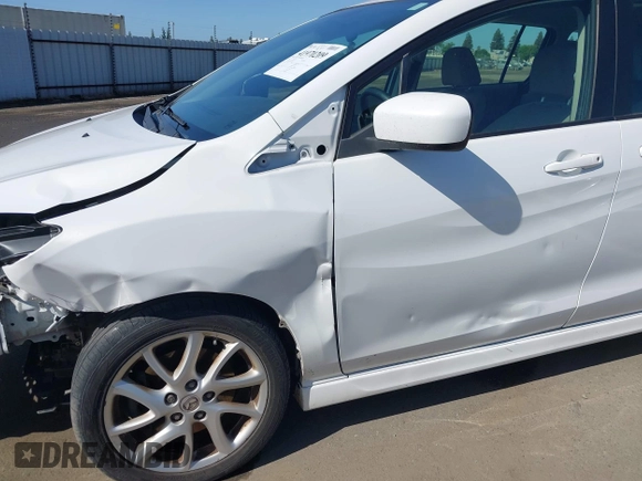 2012 Mazda 5 Touring with VIN JM1CW2CL7C0140452, listed as a IAAI auction lot 41970209 with 92,069 mi miles and . Bid and sale history available at DreamBid. Image 18.