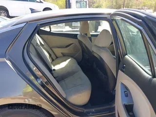 2015 Kia Optima LX with VIN 5XXGM4A74FG396236, listed as a IAAI auction lot 42165862 with 127,383 mi miles. Bid and sale history available at carsss.com. Image 8.