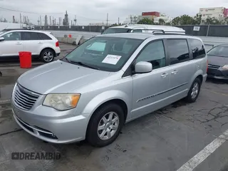 2011 Chrysler Town & Country Touring with VIN 2A4RR5DG2BR665177, listed as a IAAI auction lot 42213478 with 163,961 mi miles and . Bid and sale history available at DreamBid. Image 2.