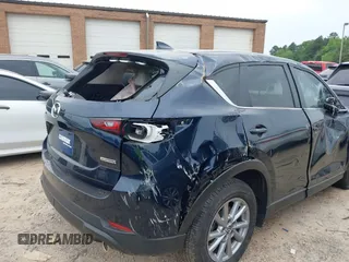 2023 Mazda CX-5 S Carbon Edition z VIN JM3KFBCM6P0251947, wystawiony jako IAAI lot #42286595 z przebiegiem 9 434 mil mil oraz . Historia ofert i sprzedaży dostępna na DreamBid. Obrazek 21.