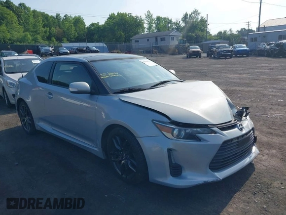 2014 Scion tC with VIN JTKJF5C78E3072572, listed as a IAAI auction lot 39680670 with 112,584 mi miles. Bid and sale history available at carsss.com. Image 1.