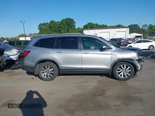 2020 Honda Pilot EX-L z VIN 5FNYF5H51LB016163, wystawiony jako IAAI lot #42030430 z przebiegiem 65 383 mil mil oraz . Historia ofert i sprzedaży dostępna na DreamBid. Obrazek 13.