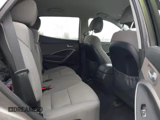 2016 Hyundai Santa Fe z VIN 5XYZTDLB1GG343763, wystawiony jako IAAI lot #41659641 z przebiegiem 96 415 mil mil oraz . Historia ofert i sprzedaży dostępna na DreamBid. Obrazek 8.