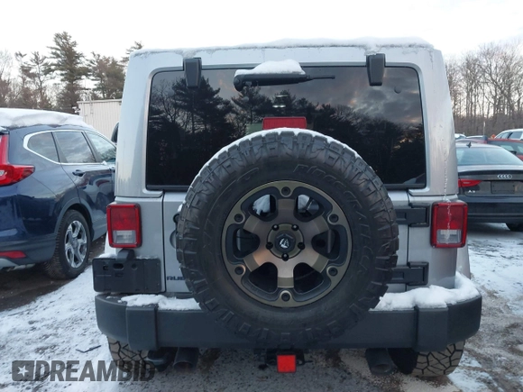 2015 Jeep Wrangler Unlimited Rubicon Hard Rock with VIN 1C4HJWFG1FL659803, listed as a IAAI auction lot 41172485 with 126,881 mi miles and . Bid and sale history available at DreamBid. Image 16.
