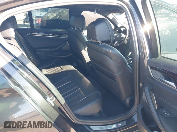 2018 BMW 5 Series M550i xDrive with VIN WBAJB9C57JG463933, listed as a IAAI auction lot 41295711 with 99,173 mi miles and . Bid and sale history available at carsss.com. Image 8.