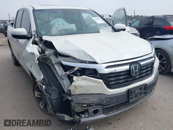 2018 Honda Ridgeline RTL-E with VIN 5FPYK3F77JB004379, listed as a IAAI auction lot 41802025 with 132,085 mi miles and . Bid and sale history available at DreamBid. Image 6.