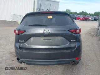 2018 Mazda CX-5 Grand Touring z VIN JM3KFADM5J1365772, wystawiony jako IAAI lot #42251805 z przebiegiem 44 599 mil mil oraz . Historia ofert i sprzedaży dostępna na DreamBid. Obrazek 15.