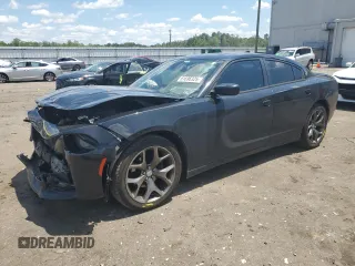 2015 Dodge Charger SXT with VIN 2C3CDXHG1FH827736, listed as a Copart auction lot 61696325 with 187,503 mi miles and Salvage title. Bid and sale history available at DreamBid. Image 1.