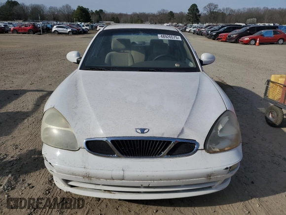 2001 Daewoo Nubira z VIN KLAJC52Z01K711120, wystawiony jako Copart lot #48926575 z przebiegiem 103 375 mil mil oraz Tytuł czysty. Historia ofert i sprzedaży dostępna na DreamBid. Obrazek 5.