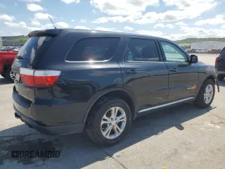 2013 Dodge Durango SXT with VIN 1C4RDJAG3DC575923, listed as a Copart auction lot 60100195 with 211,606 mi miles and Salvage title. Bid and sale history available at DreamBid. Image 3.
