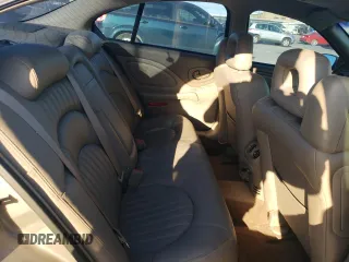 2002 Pontiac Bonneville SLE z VIN 1G2HY54K424205499, wystawiony jako Copart lot #76815334 z przebiegiem 84 715 mil mil oraz Szkoda całkowita • Salvage title. Historia ofert i sprzedaży dostępna na DreamBid. Obrazek 10.