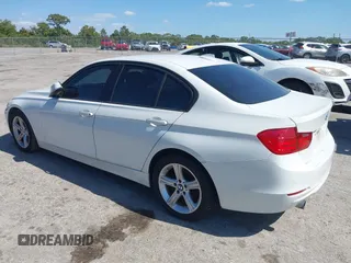 2014 BMW 3 Series 320i with VIN WBA3B1G53ENT00444, listed as a IAAI auction lot 42082984 with 94,401 mi miles. Bid and sale history available at carsss.com. Image 3.