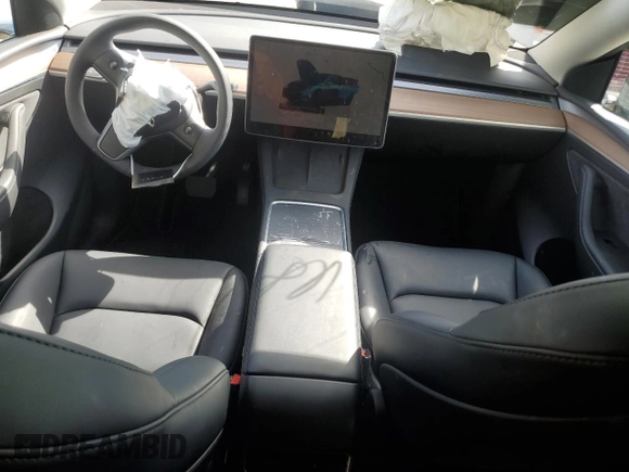 2025 Tesla Model Y Long Range with VIN 7SAYGAEEXSF253326, listed as a Copart auction lot 49527965 with 5,803 mi miles and Salvage Title. Bid and sale history available at DreamBid. Image 8.