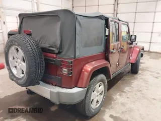2008 Jeep Wrangler Unlimited Sahara z VIN 1J4GA59178L514002, wystawiony jako IAAI lot #41949717 z przebiegiem Nie podano mil oraz . Historia ofert i sprzedaży dostępna na DreamBid. Obrazek 4.