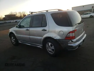 2002 Mercedes-Benz M-Class with VIN 4JGAB54E32A312131, listed as a Copart auction lot 80490084 with 165,365 mi miles and Salvage Title. Bid and sale history available at carsss.com. Image 2.